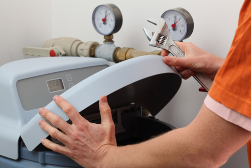 Plumber Installing a water softener 1