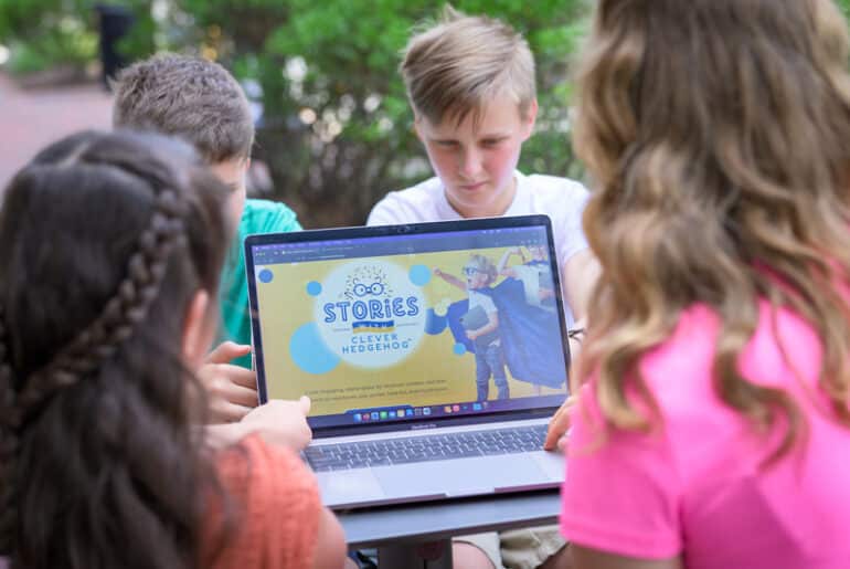 children reading book computer